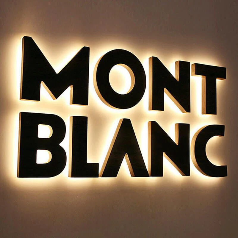 Halo lit reverse channel letters with glow on wall